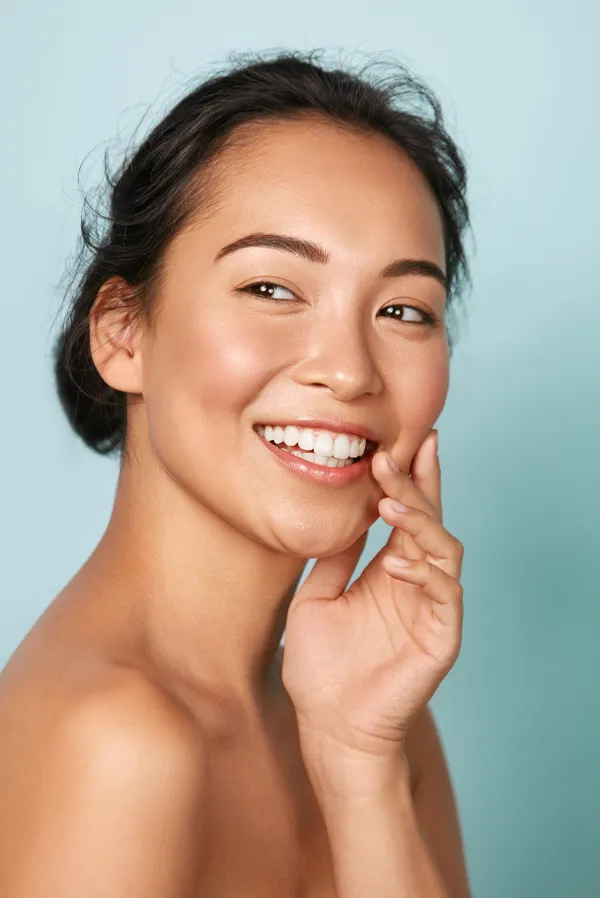Dysport-Facial-Injections-Treatment An asian woman with radiant skin. Get Dysport facial injections from Tanya Zboril, NP of TBT Medical in Kitchener-Waterloo.