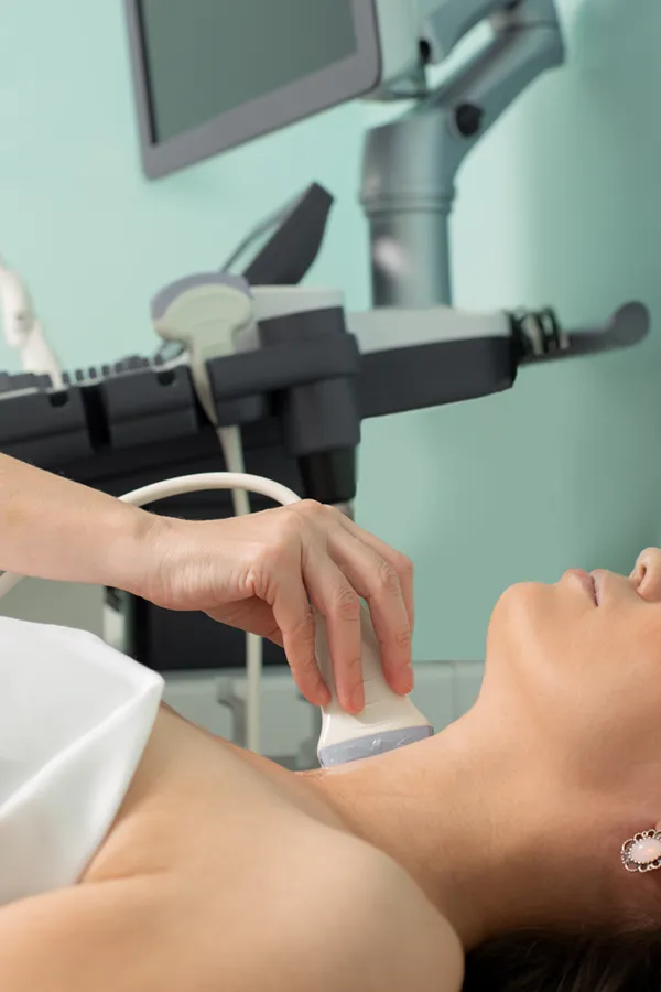 Hashimotos-Thyroiditis-Treatment A woman gets a thyroid scan from a doctor in a clinic. Get help with Hashimoto's Thyroiditis from Tanya Zboril, NP of TBT Medical in Kitchener-Waterloo.