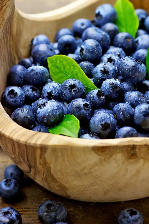 IV-Therapy-Treatment A bowl of refreshing, nourishing blueberries in a wooden bowl, representing IV therapy from Tanya Zboril, NP of TBT Medical in Kitchener-Waterloo.