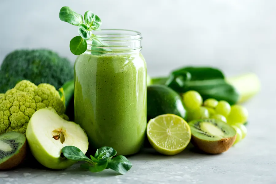 Nutritional-Counseling-Clinic A tableau of healthy green fruits and vegetables and juices. Get nutritional counseling from Tanya Zboril, NP of TBT Medical in Kitchener-Waterloo.